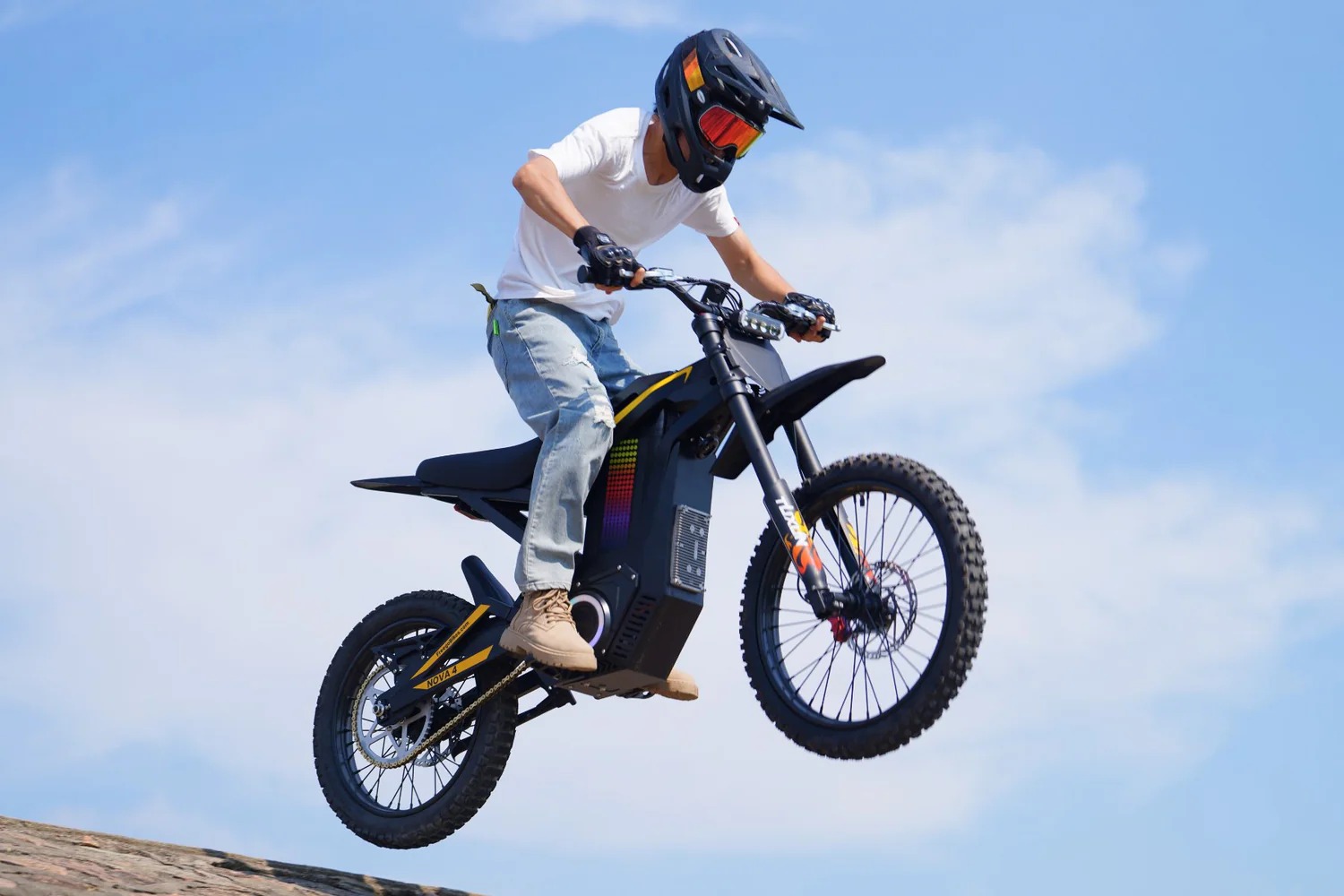 Rider jumping with Freego Nova4 electric dirt bike outdoors